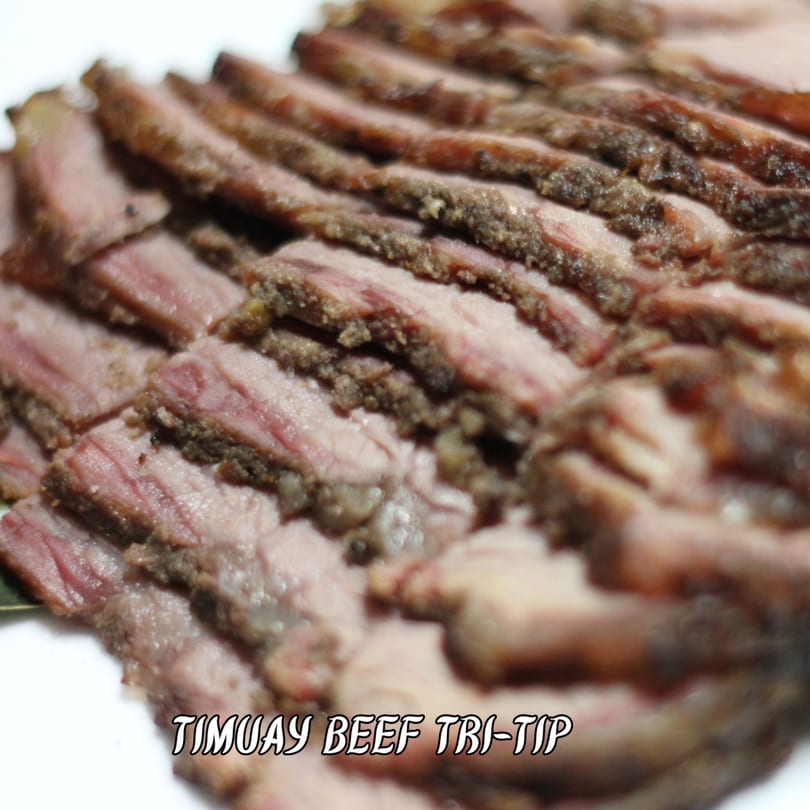 Sliced Timuay Beef Tri-Tip with a savory crust and tender pink interior.